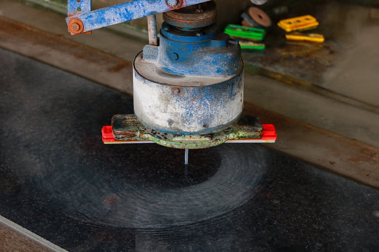 Technician grinding a dull etched marble floor during restoration