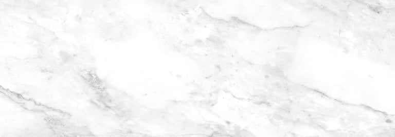 White marble countertop polished to a crisp high-gloss finish with visible veining