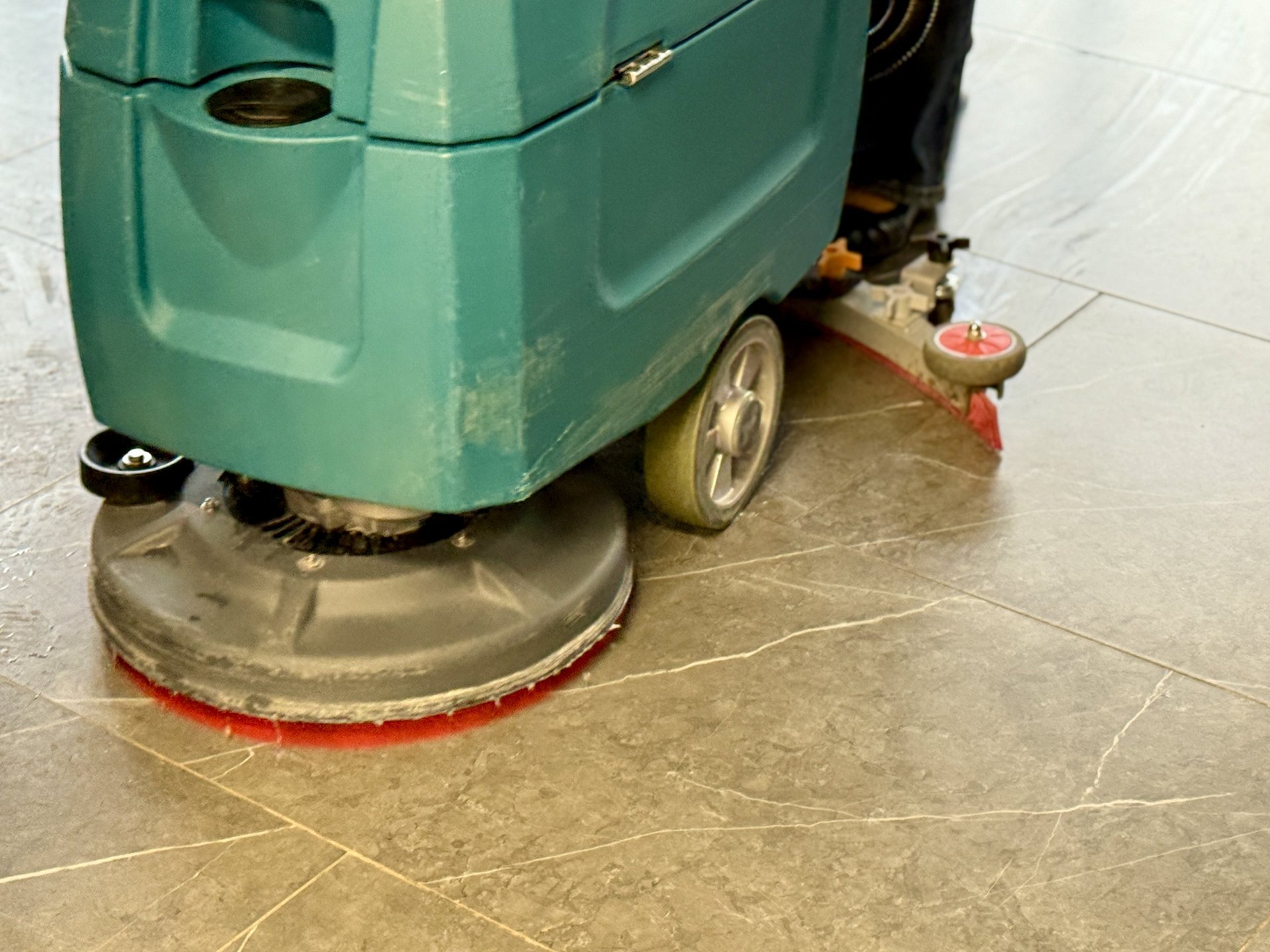 Polished marble and tile floor being restored in a Virginia Beach commercial lobby