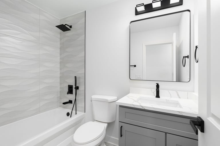 Modern bathroom with a repaired and polished white marble countertop