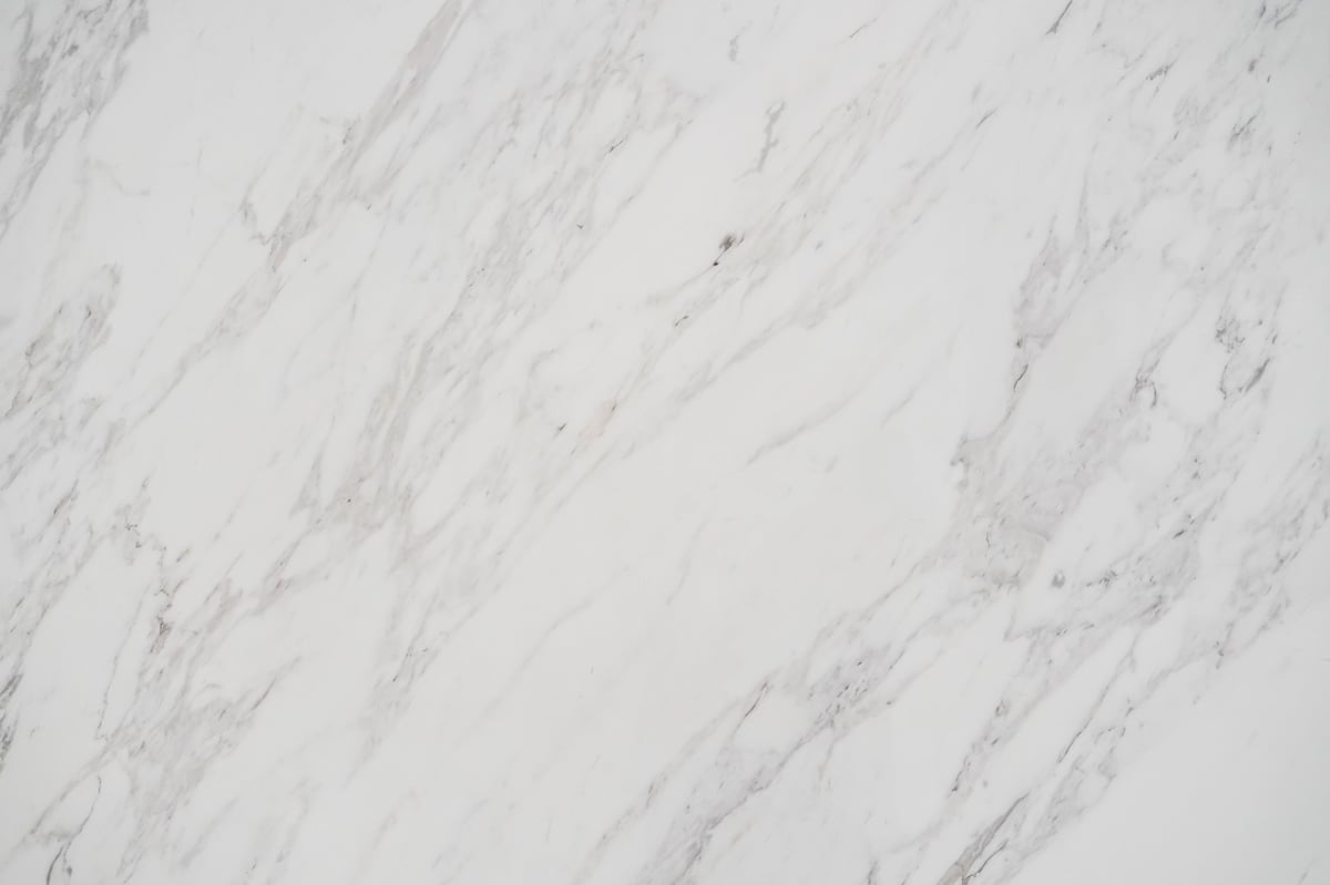 Dull and hazy marble floor surface in a Raleigh NC home that has lost its shine