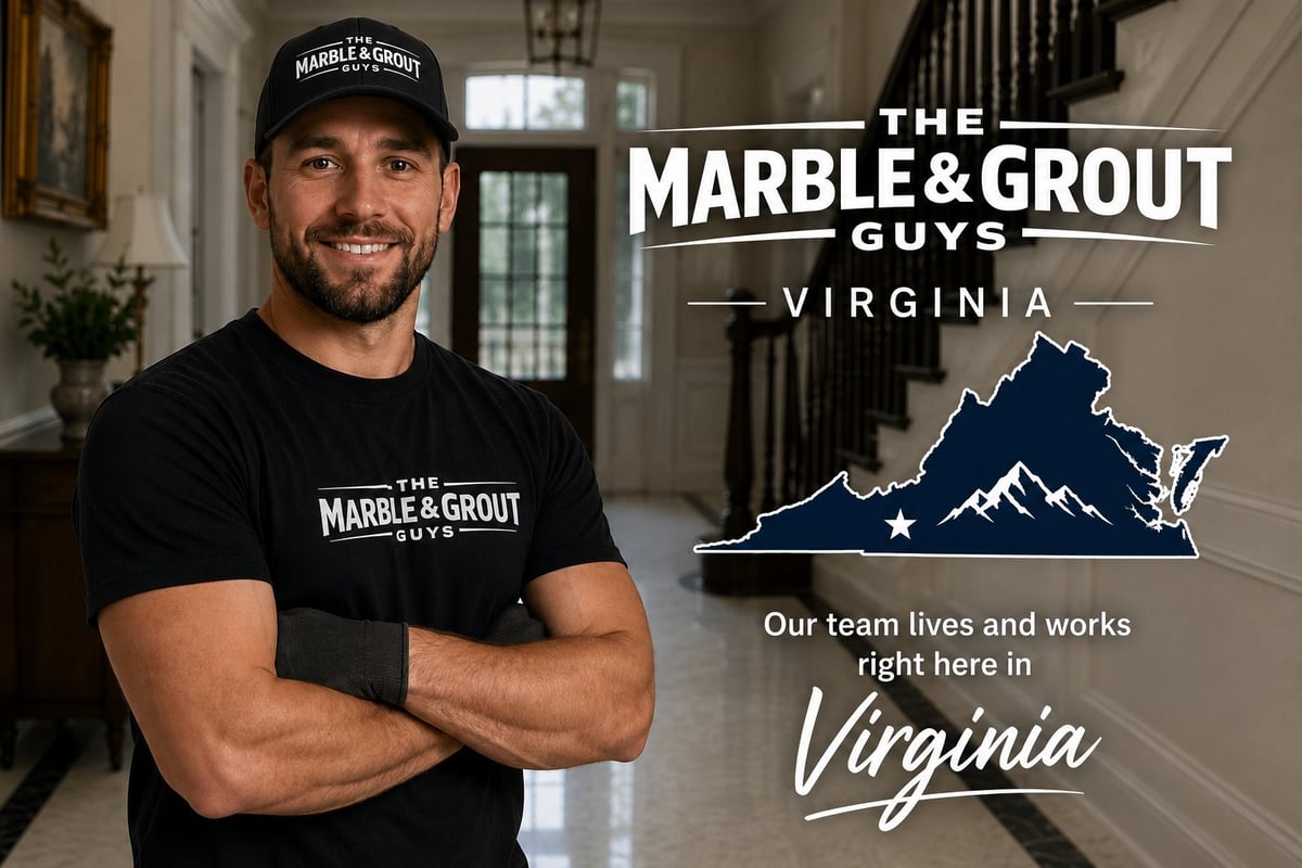 Man in The Marble and Grout Guys branded cap and shirt standing in elegant home with Virginia state graphic and company branding