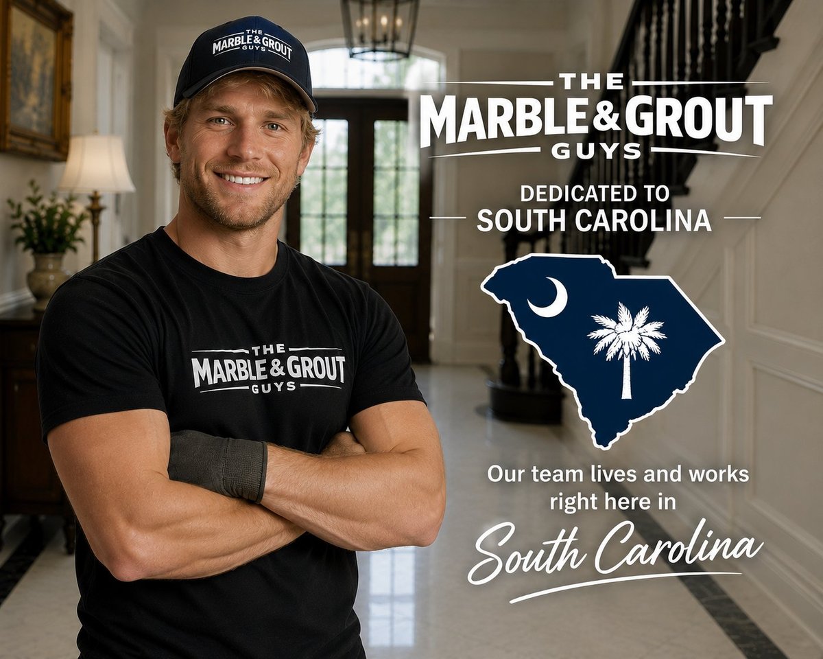 Man in The Marble and Grout Guys branded shirt and cap standing in elegant home interior with South Carolina state silhouette graphic
